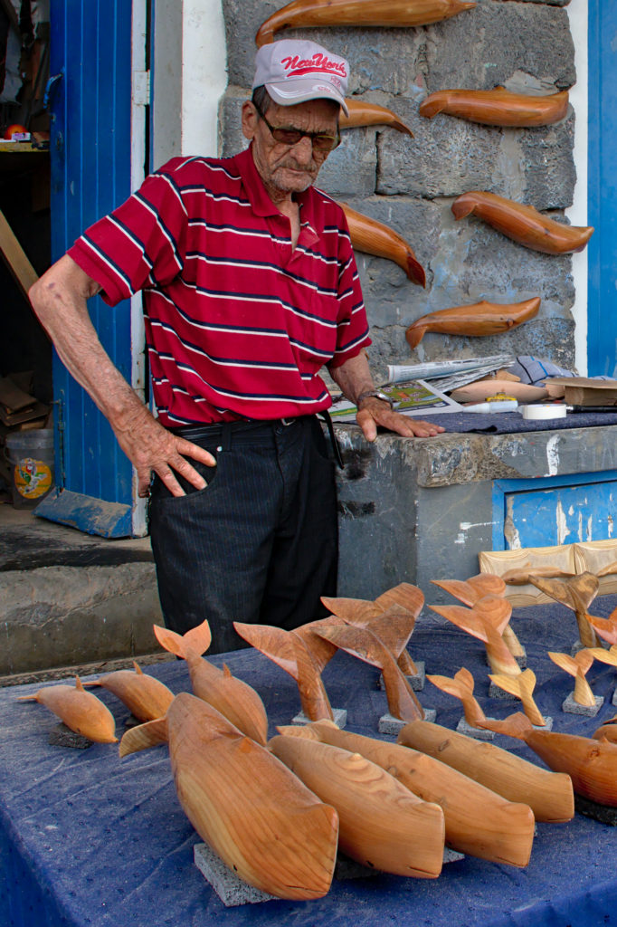 Vendor of carvings in the port of Vila Franca do Campo