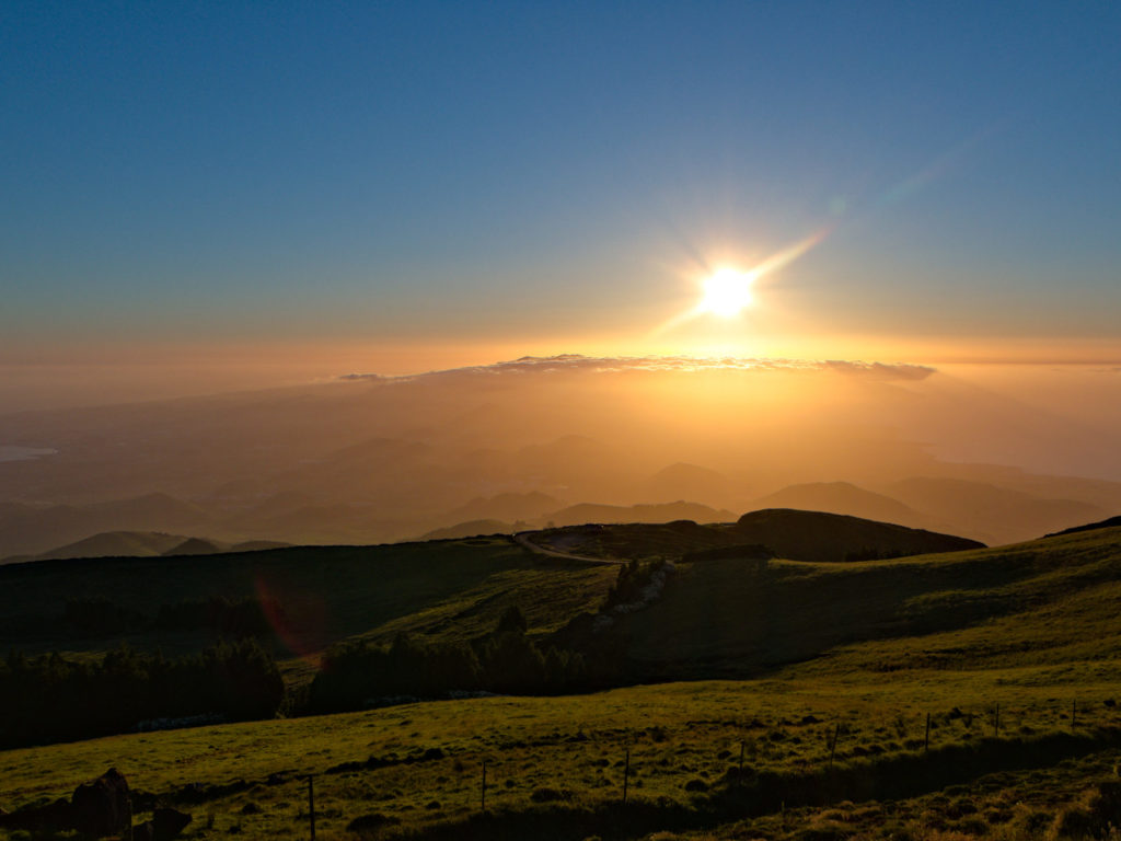 The sun seems to be sinking in the crater near Sete Cidades The sun seems to be sinking in the crater near Sete Cidades